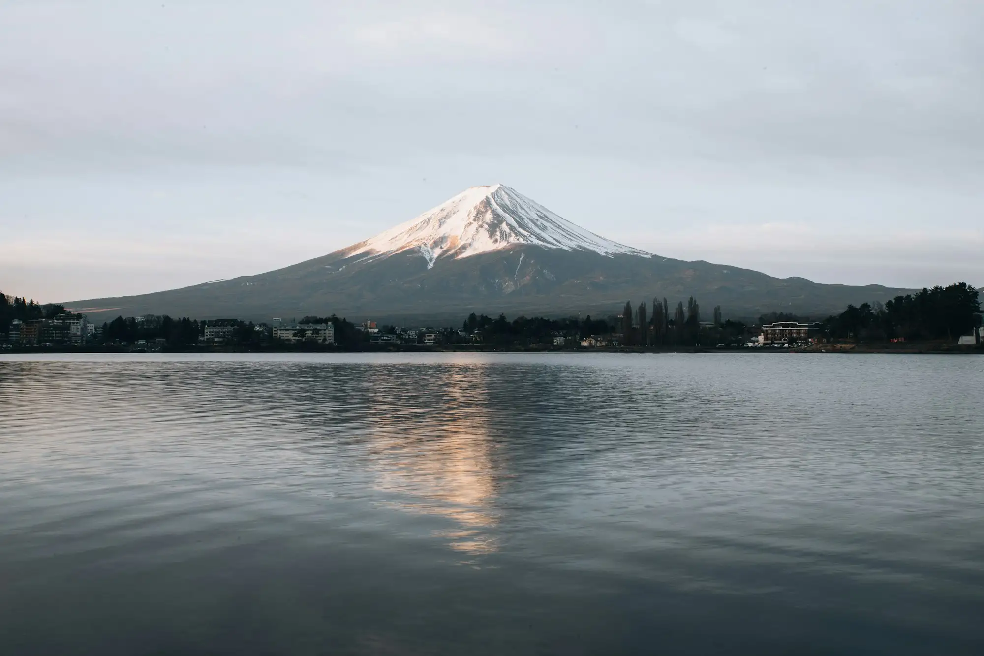 Mt. Fuji reflected in a lake at dusk